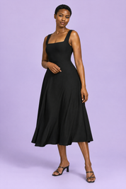 Robe midi noire à fines bretelles et jupe ample | Vue de face | Lounelle Paris
