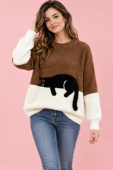 Oversized brun striktrøje med kattemotiv