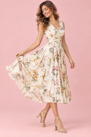 Robe midi verte à imprimé de bouquets floraux, col carré et coupe trapèze | Vue de dos | Lounelle Paris