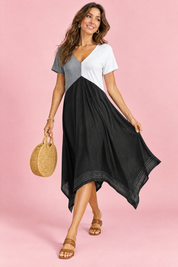 Robe midi noire asymétrique à col V | Vue en mouvement | Lounelle Paris