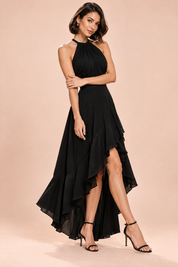 Robe noire à volants asymétriques et encolure dos nu | Vue de dos | Lounelle Paris